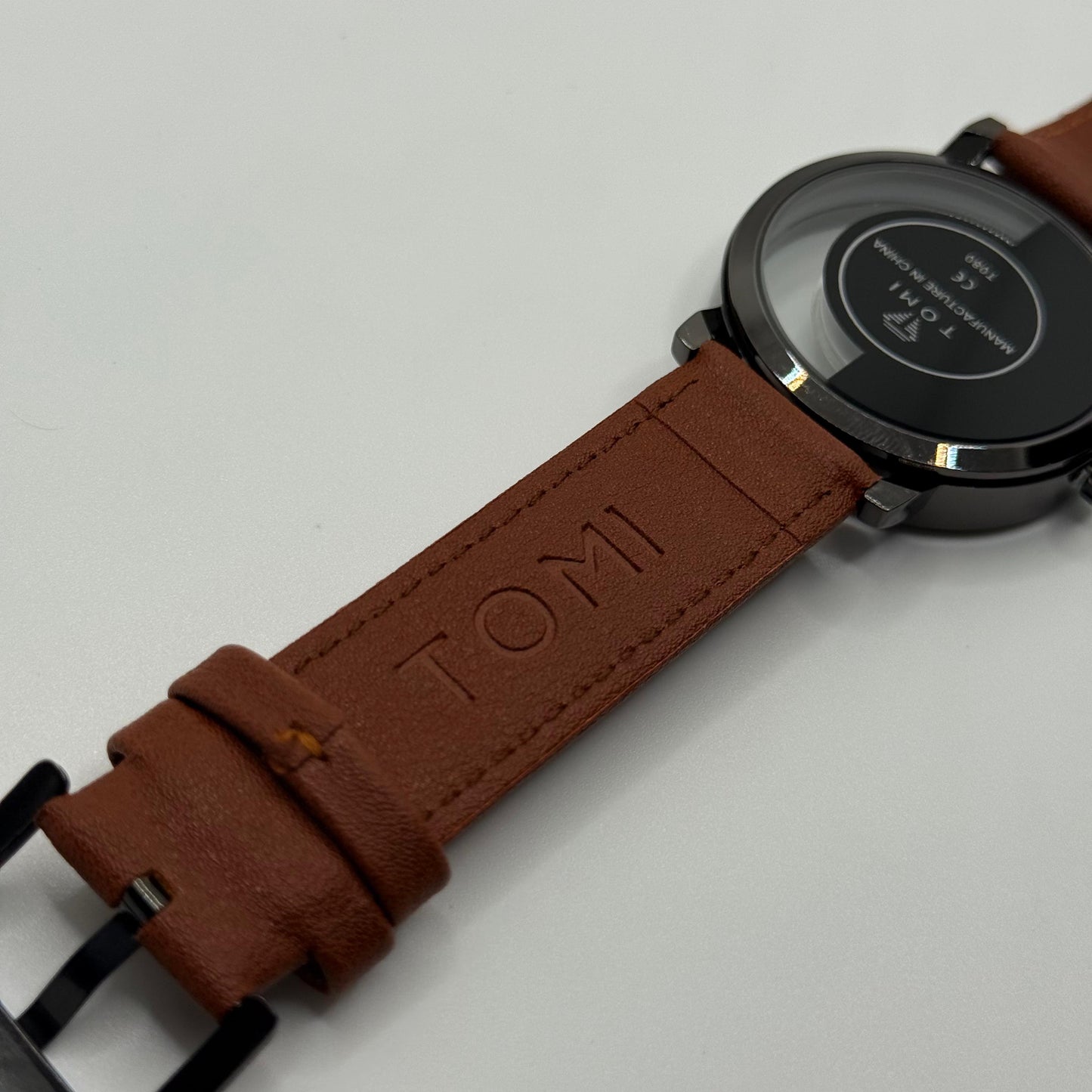 TOMI transparent dial with brown leather strap