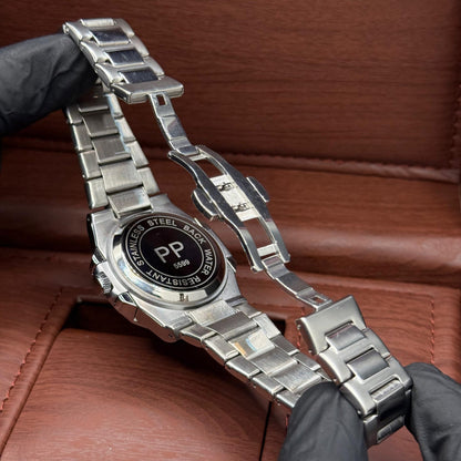 pp silver with blue dial with date