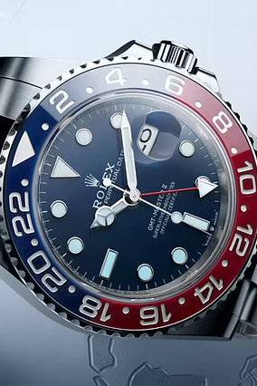 Rolex watch with blue and red bezel